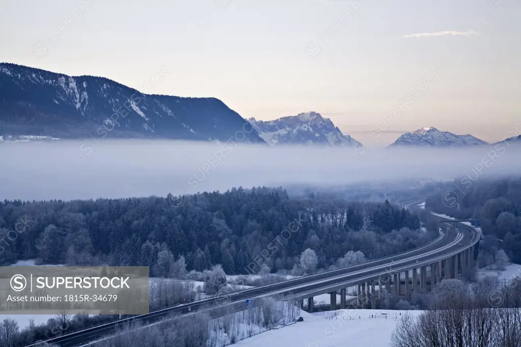 Germany, Bavaria, Highway bridge with mountain landscape