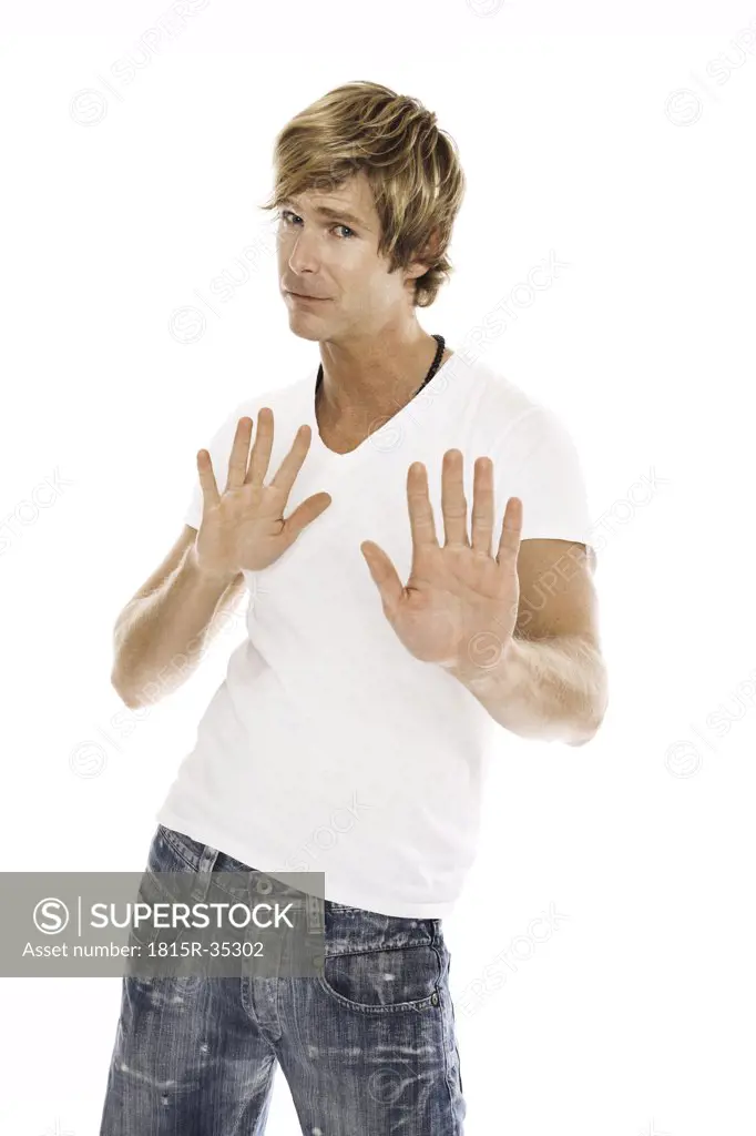 Man making rejecting hand gesture, close-up