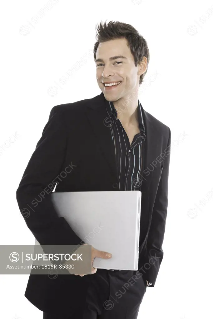 Young man holding laptop, close-up