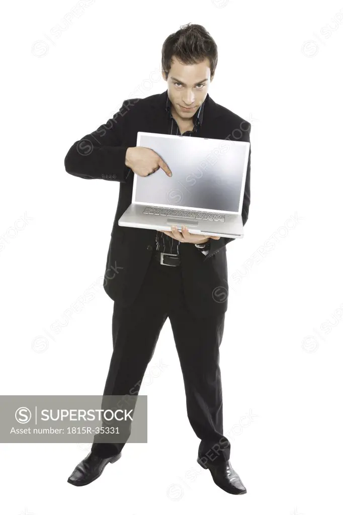 Young man holding laptop, close-up