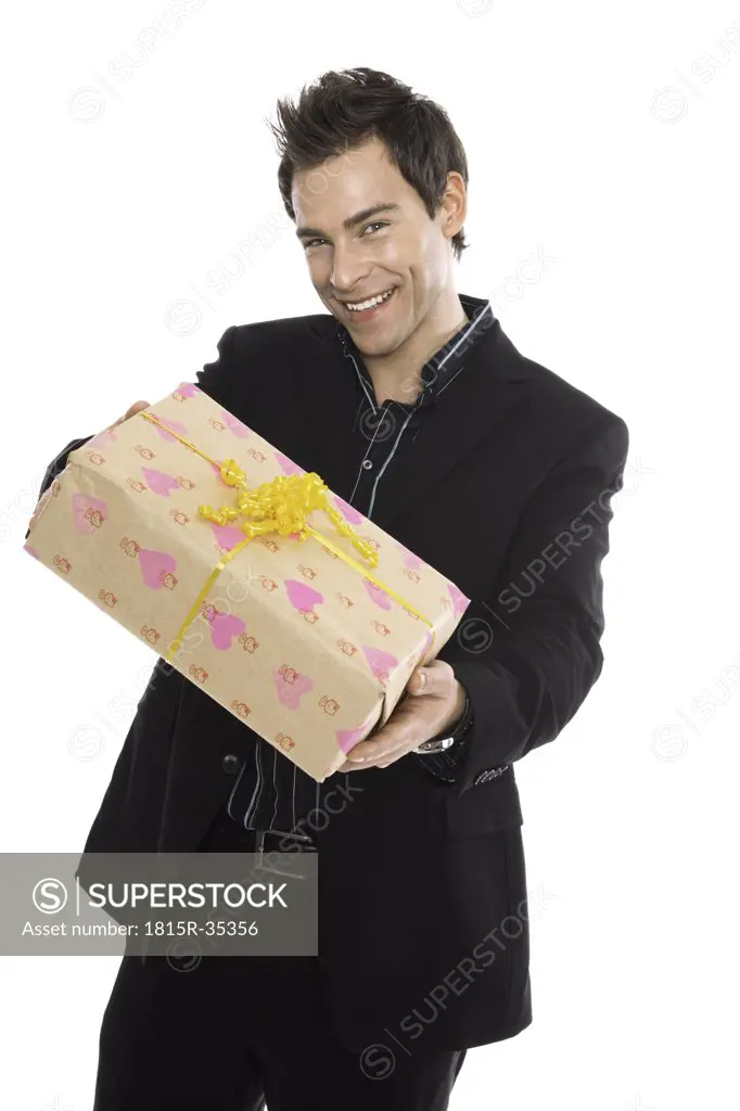 Young man holding present, close-up