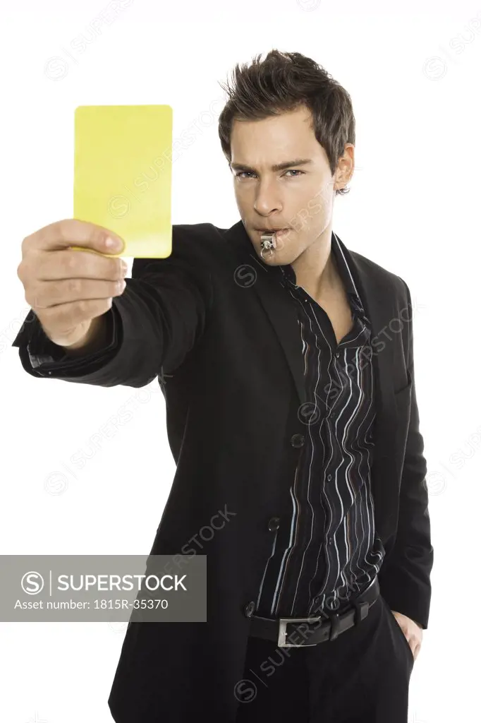 Young man showing yellow card, close-up