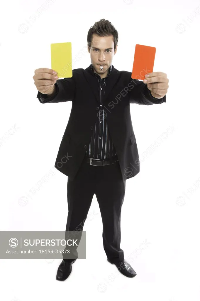 Young man holding red and yellow card close-up