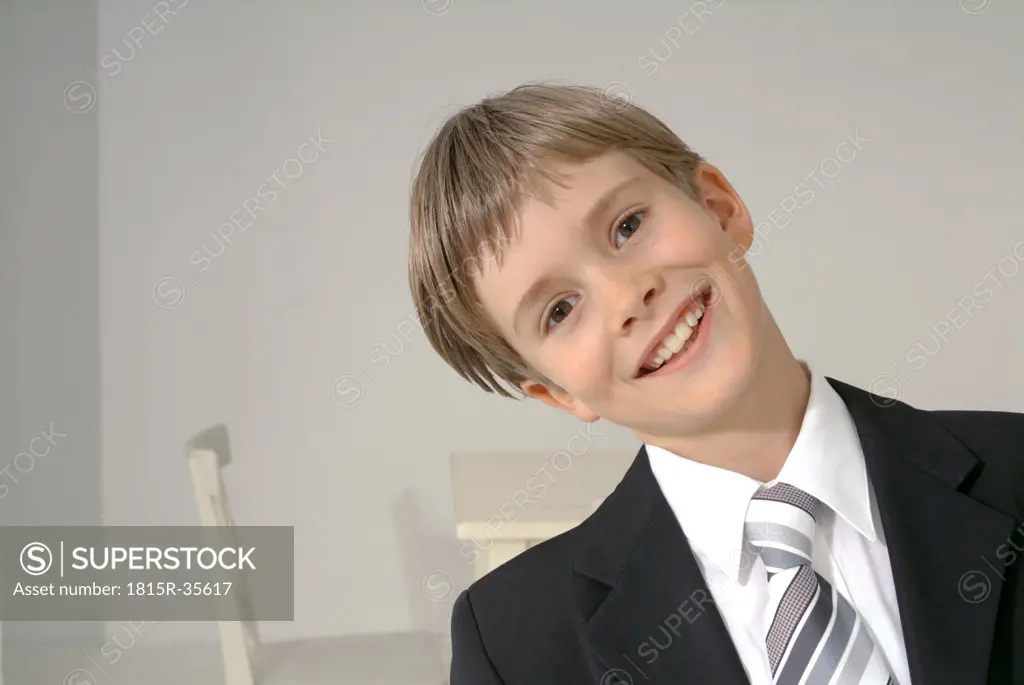 Boy dressed for First Communion, portrait