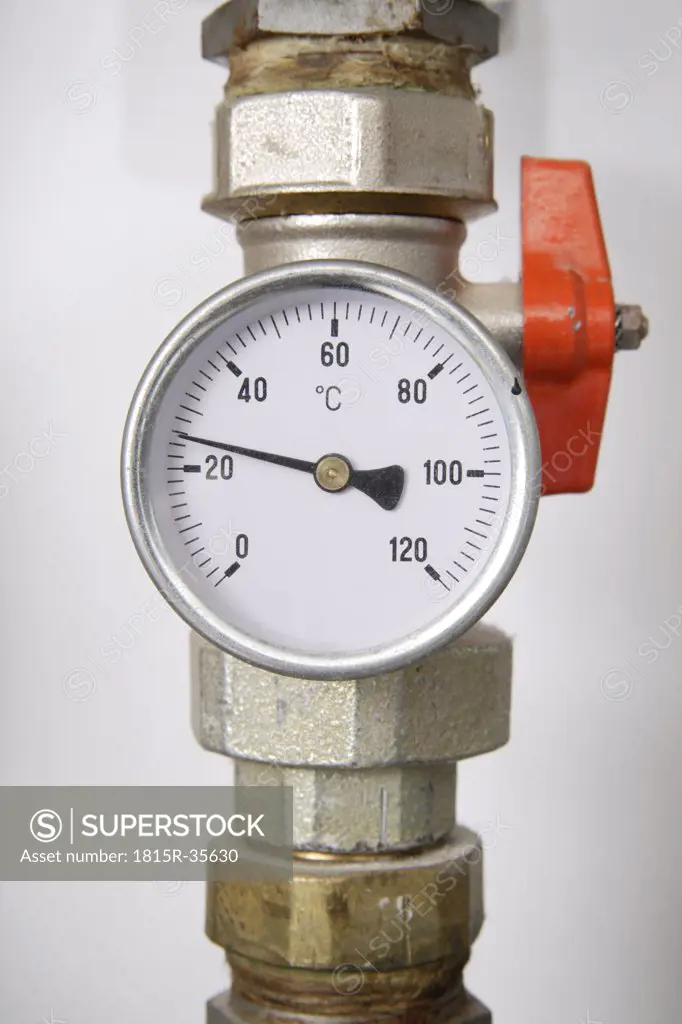 Thermometer on pipeline, close-up