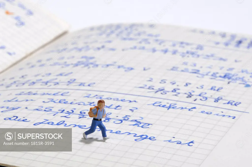 Figurine of Schoolboy on exercise book