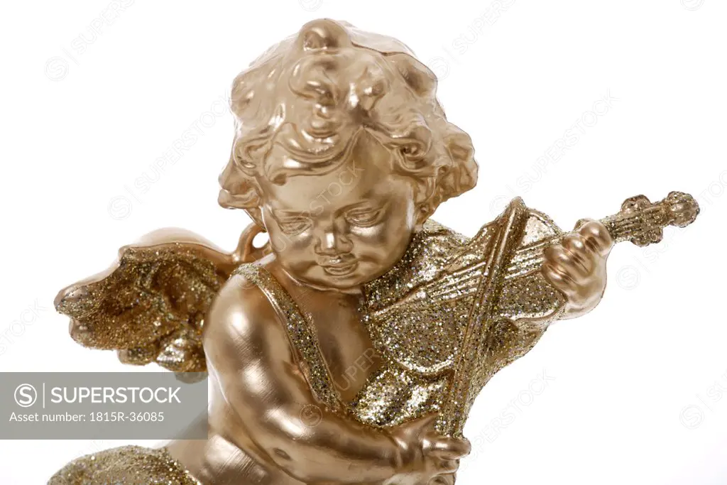 Golden putto playing the violin, close up