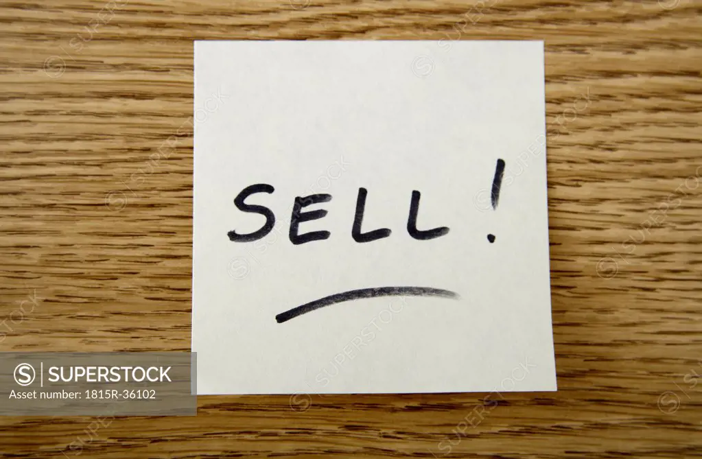 Adhesive note saying ""sell""