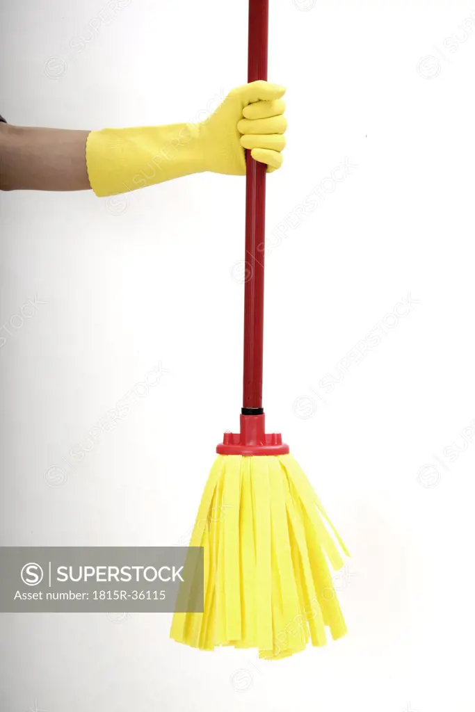 Hand holding cleaning mop