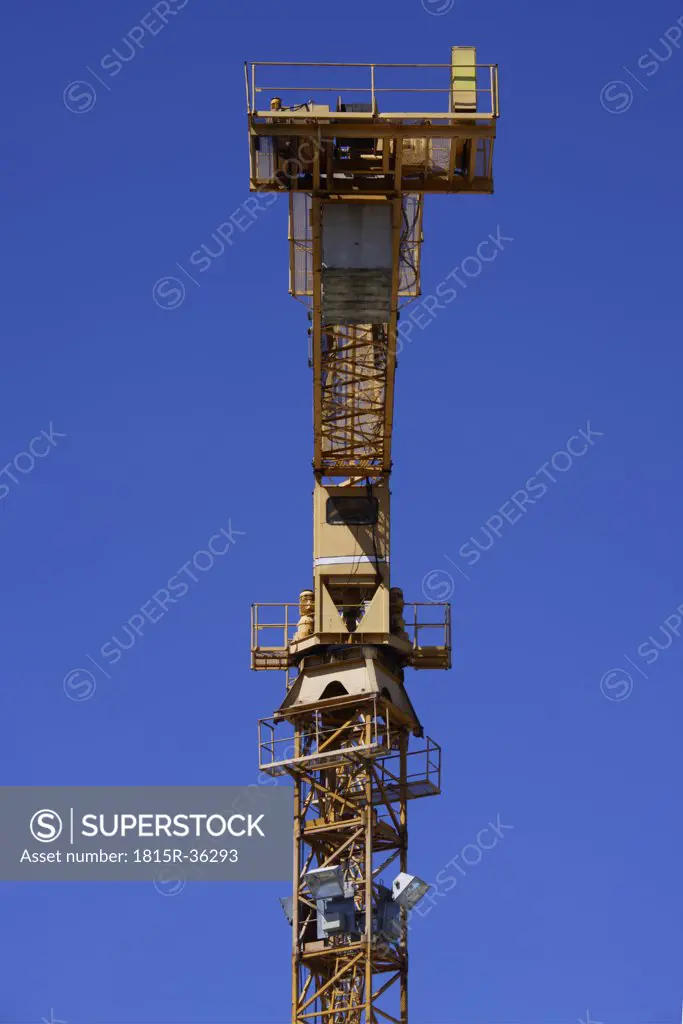 Germany, Bavaria, Munich, Construction crane against blue sky
