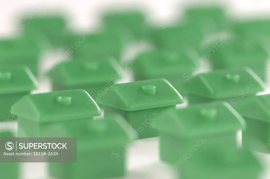 Green plastic miniature houses