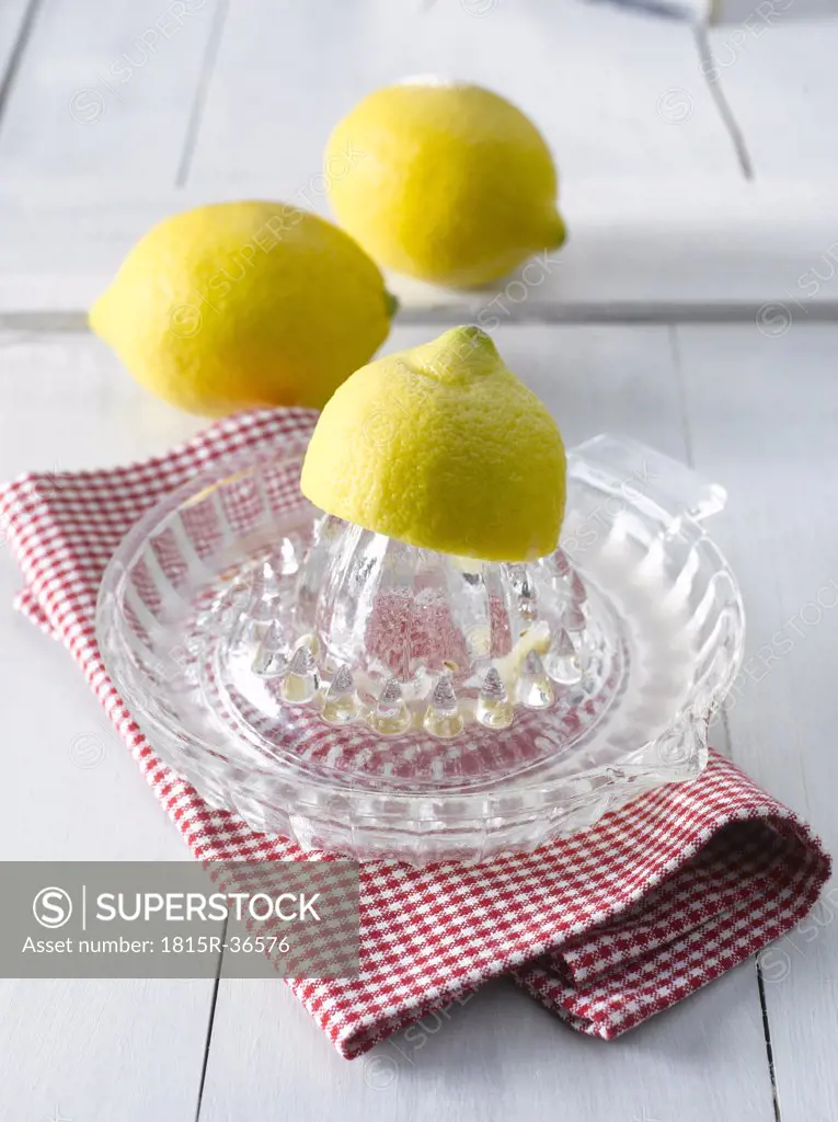 Lemons on lemon squeezer