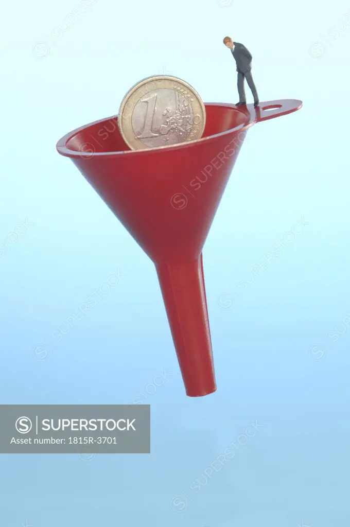 Business man figurine standing on funnel