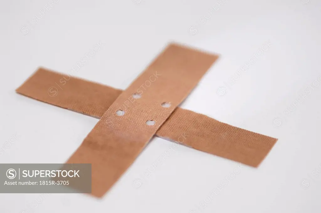 Crossed band-aids, close-up