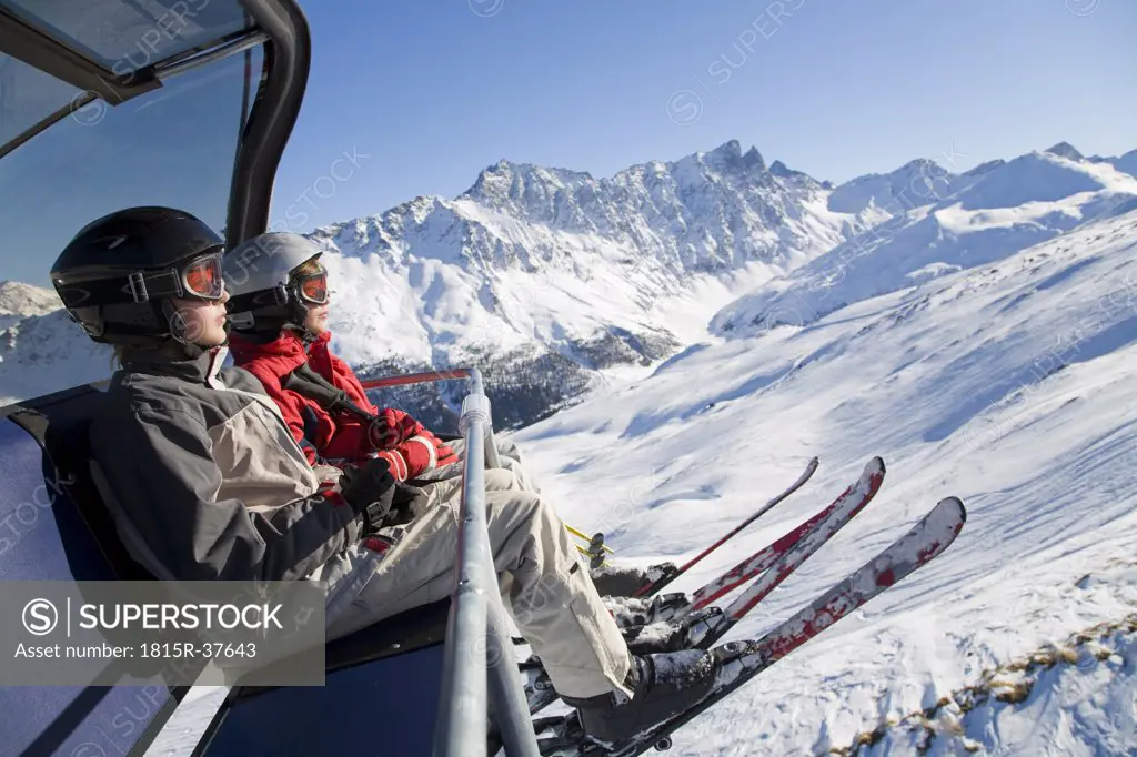 Switzerland, Graubuenden, Savognin, Children's (8-9) in ski lift
