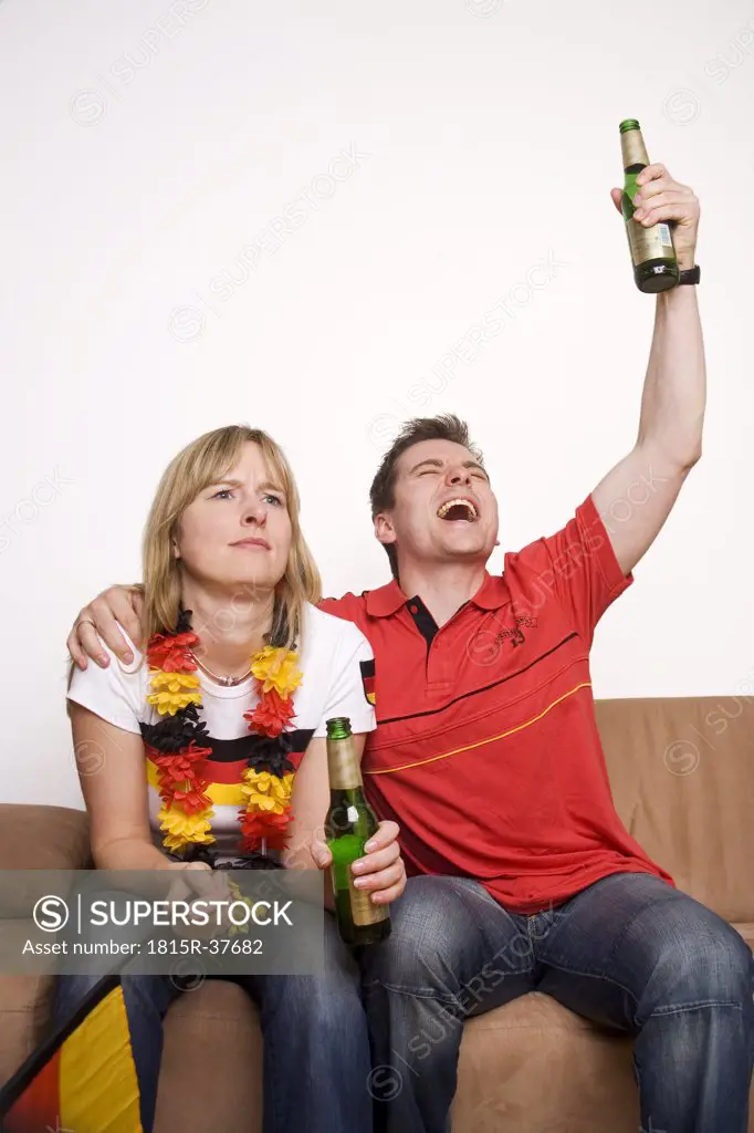 Soccer Fans watching Soccer Game on Television