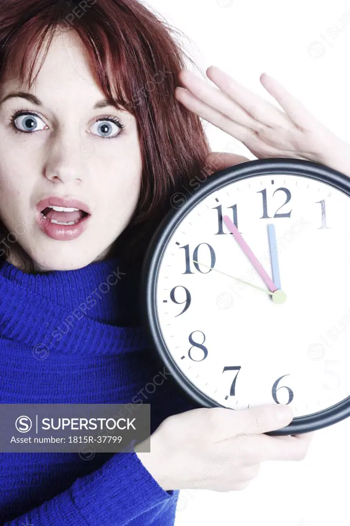 Woman holding wall clock