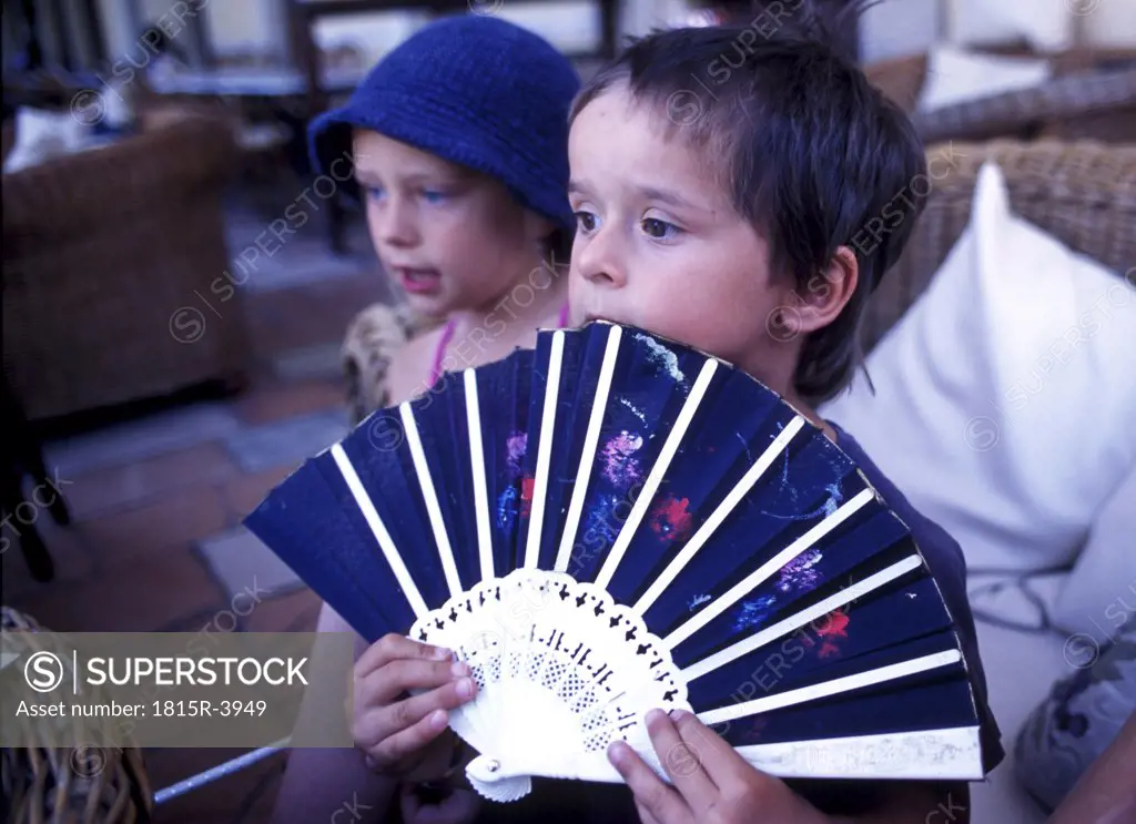 Children playing with a fan, Corfu town (Kerkyra), Corfu Greece