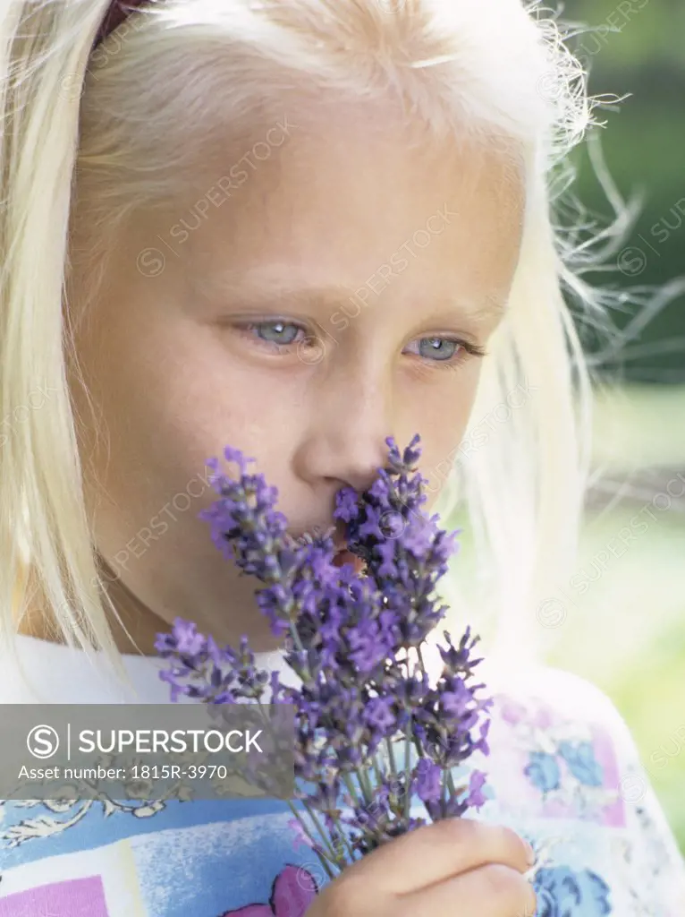 Girl smelling lavender, close-up