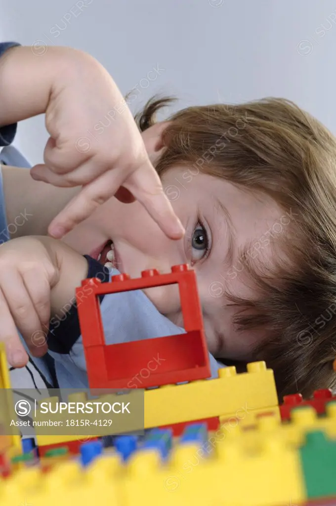 Boy playing with LEGO bricks