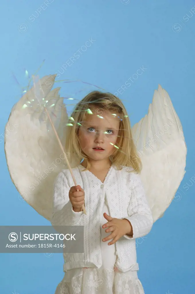 Girl (3-4) dressed in angel's costume