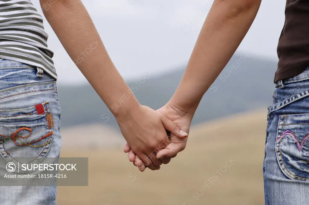 Holding hands, close-up