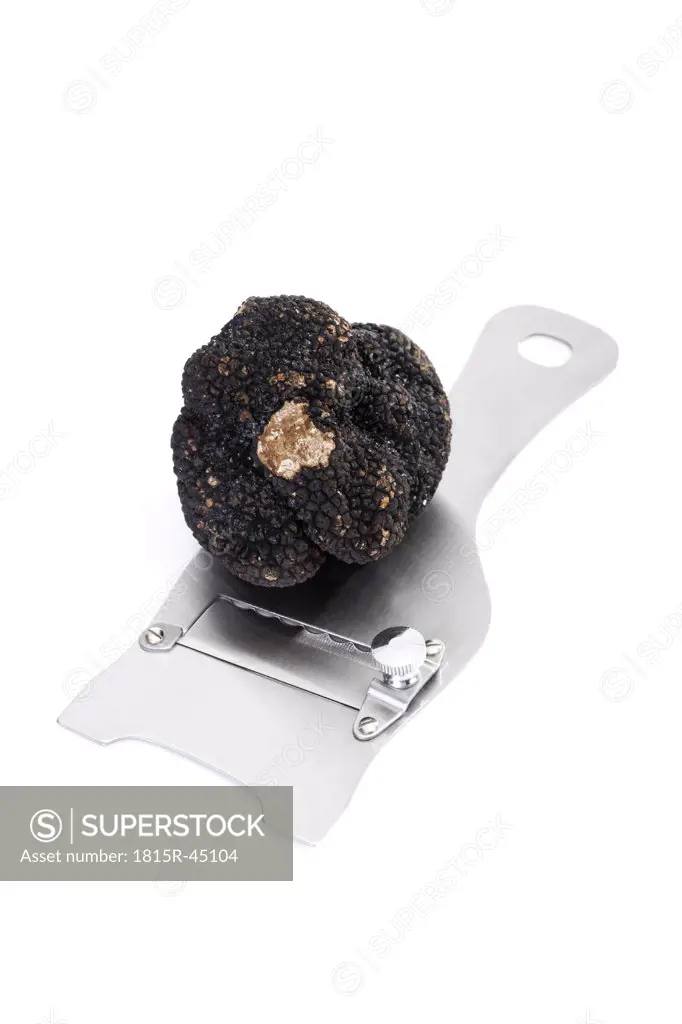Black truffle on truffle slicer