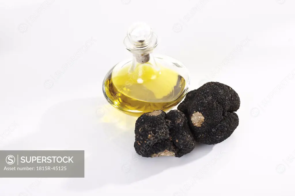 Black Truffles and a bottle of oil, elevated view