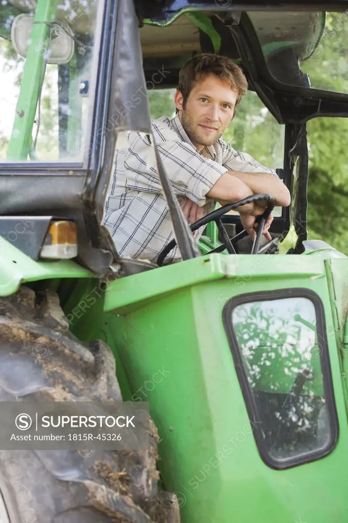 Farmer sitting on tractor