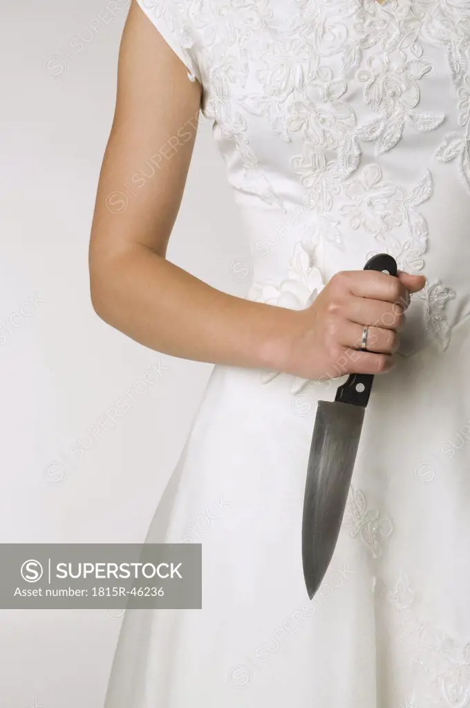 Bride holding knife, close-up