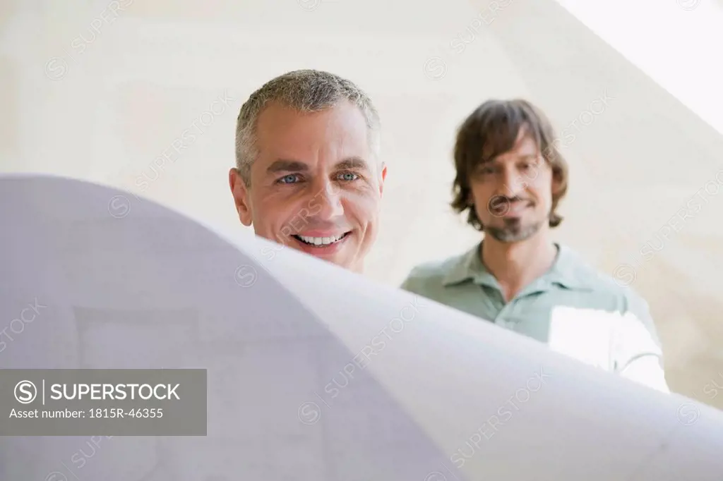 Two men looking at construction plan