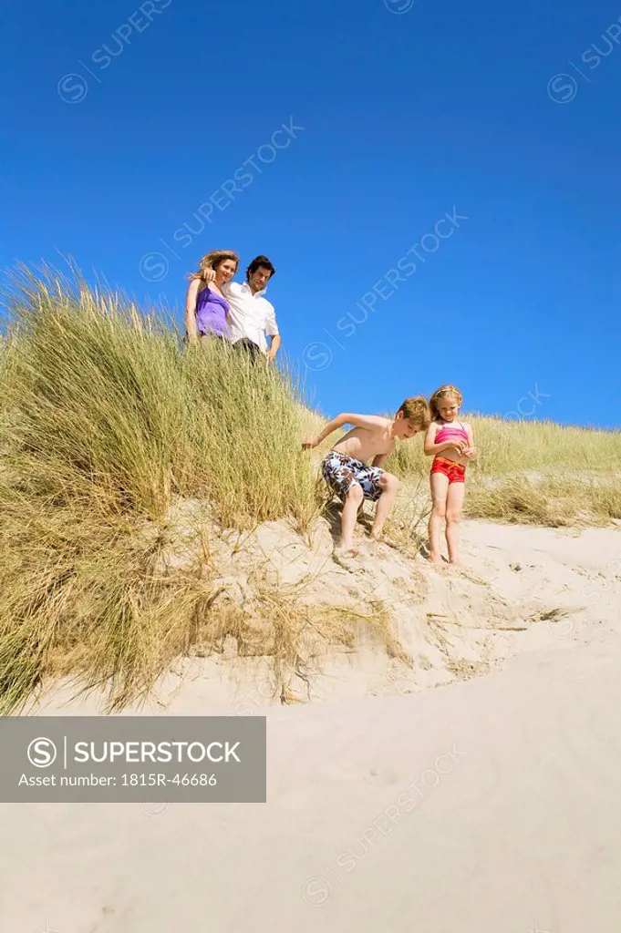 Germany, Baltic sea, Family in sand dunes