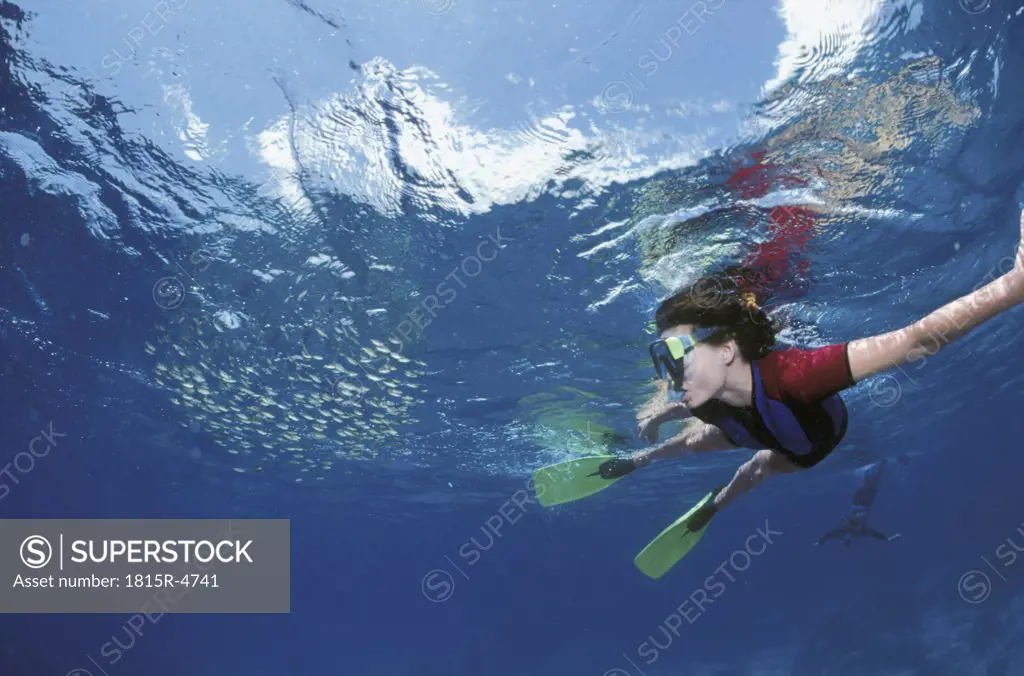 Young woman snorkeling, underwater view