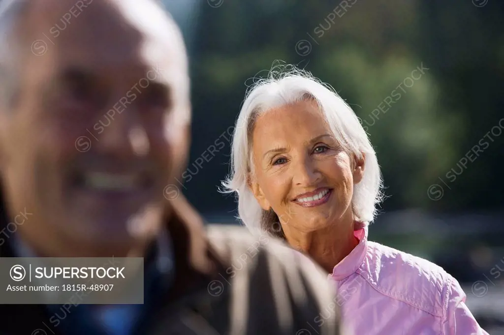 Germany, Bavaria, Walchensee, Senior couple smiling, portrait