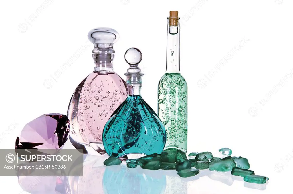 Bottles with bath essences, gemstones, close up