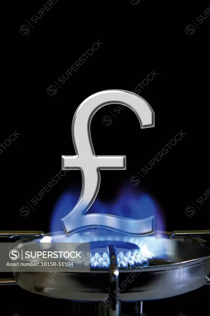 Flame of gas stove and British pound sign, close_up