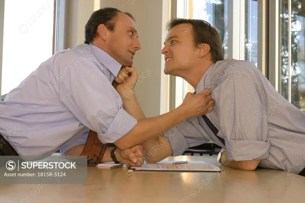 Two business men in office, disputing