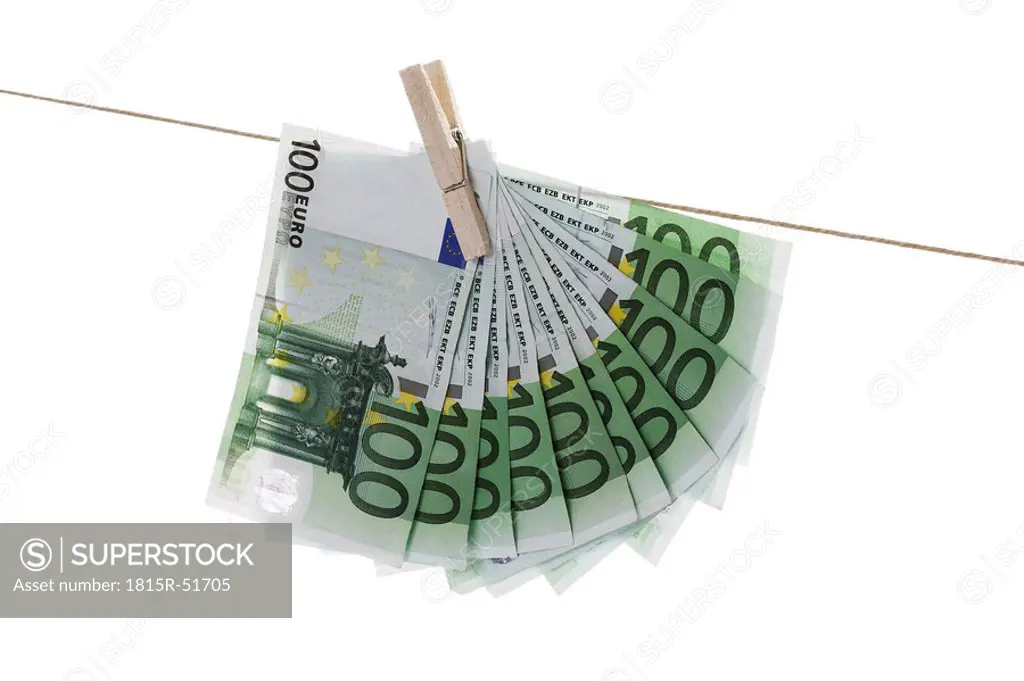 100 Euro bank notes hanging on clothesline