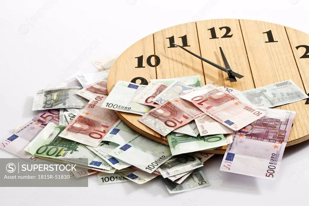 Euro bank notes and clock, symbol for time is money