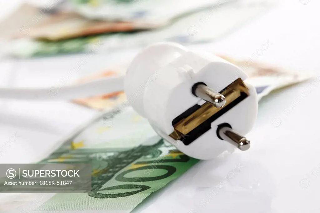 White plug and banknotes, close_up