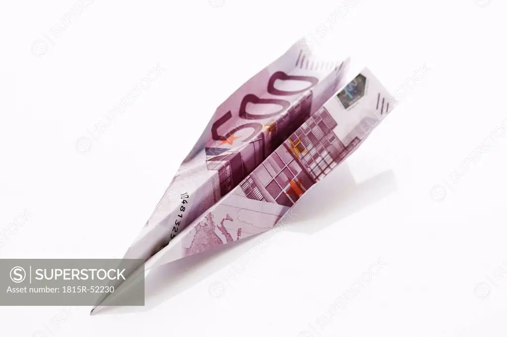 Paper aeroplane folded from 500 Euro banknote