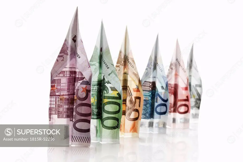 Paper aeroplanes folded from Euro banknotes