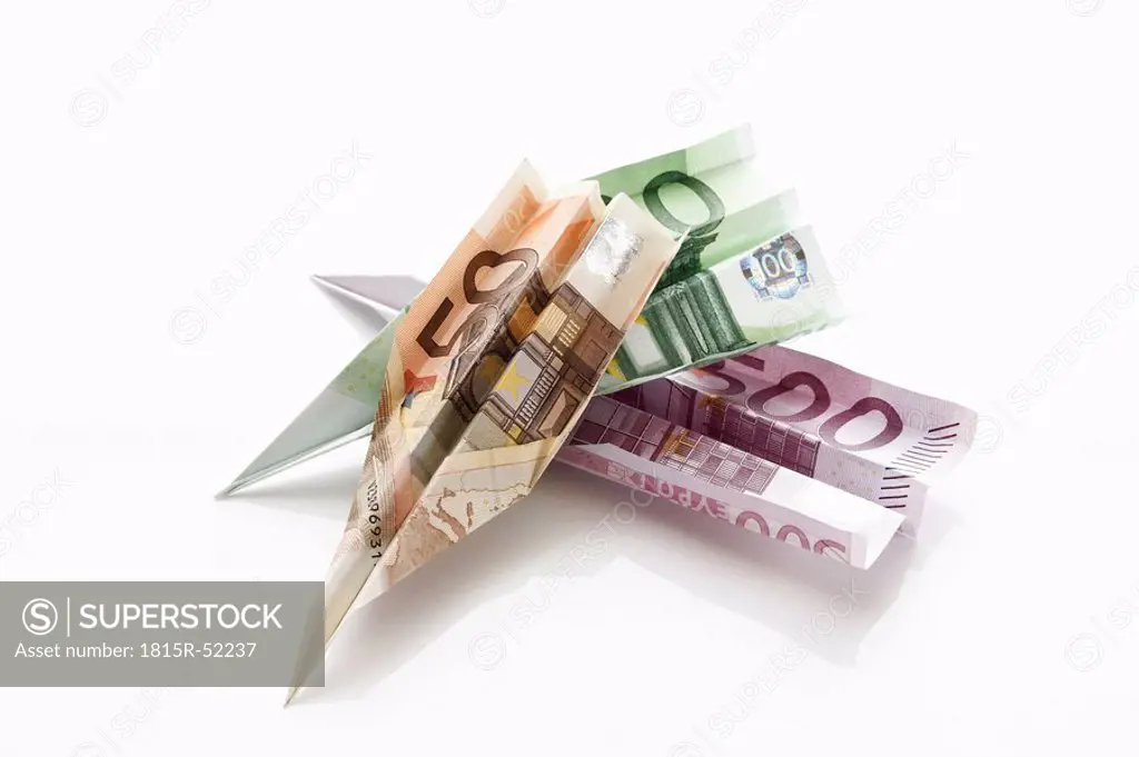 Paper aeroplanes folded from Euro banknotes