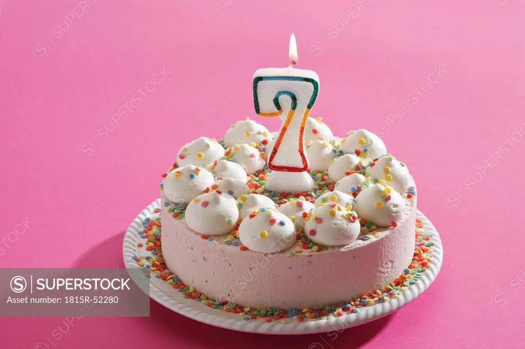 Birthday cake with burning candle