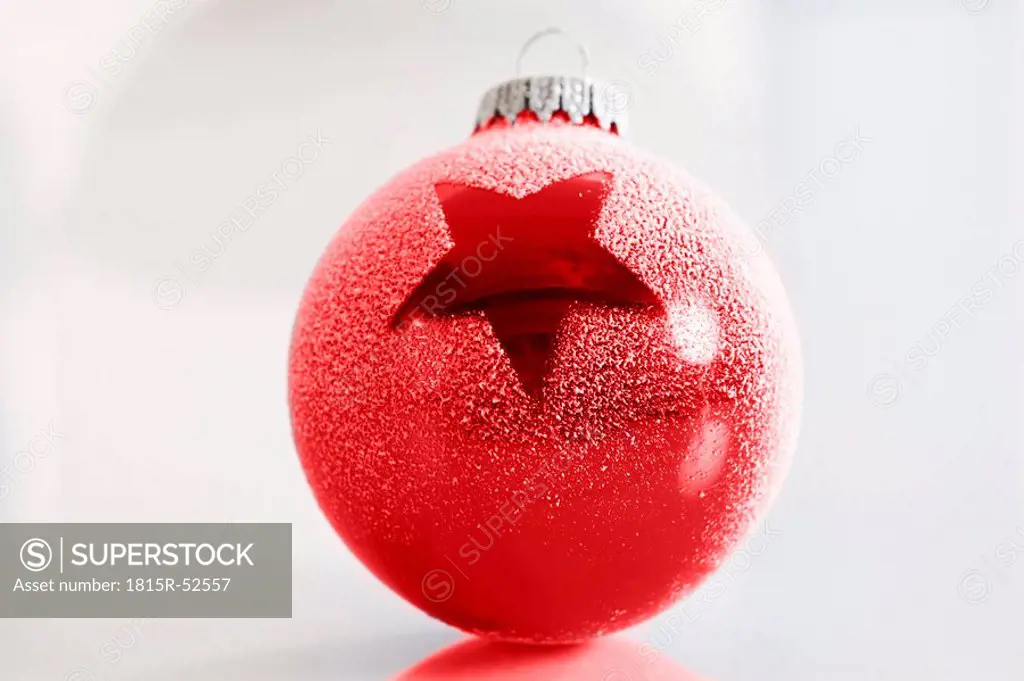 Red christmas bauble with star motive, close_up