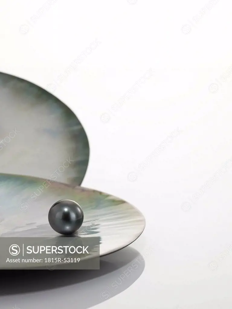 Black pearl on shell