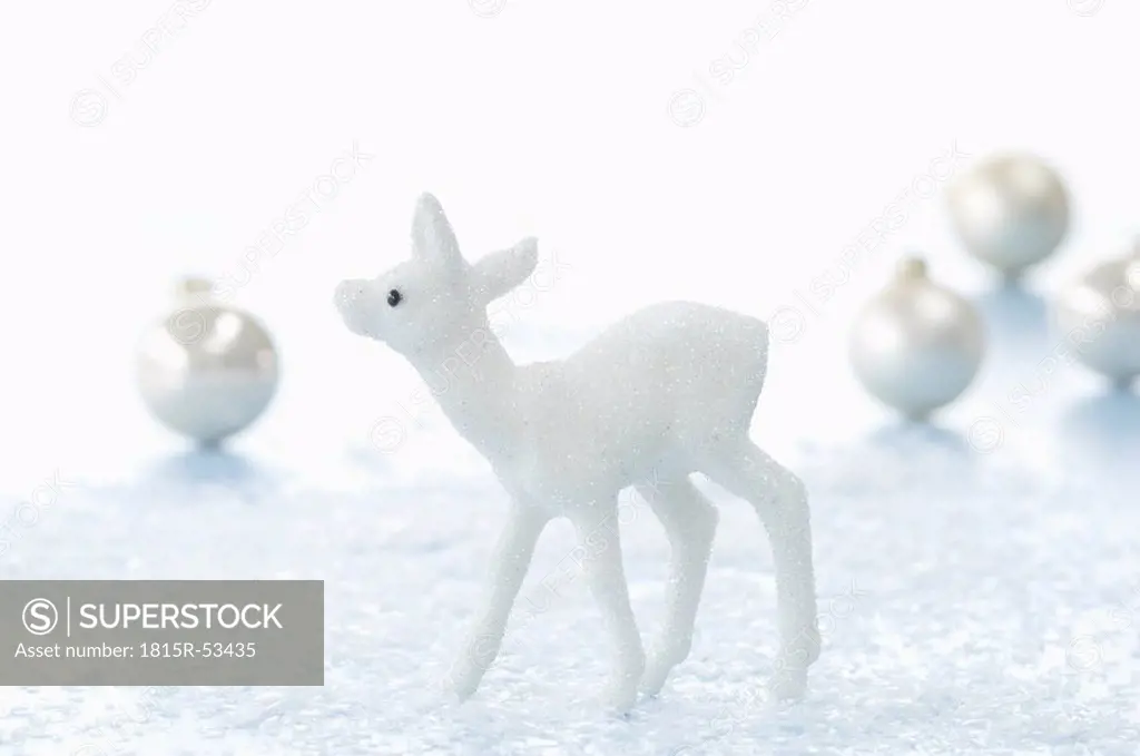 Christmas decoration, Deer figurine, Christmas baubles in background