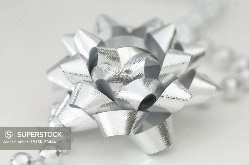 Silver ribbon, bow and pearls
