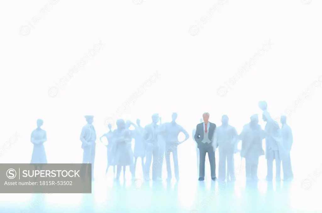 Businessman figurine and silhouettes of figurines