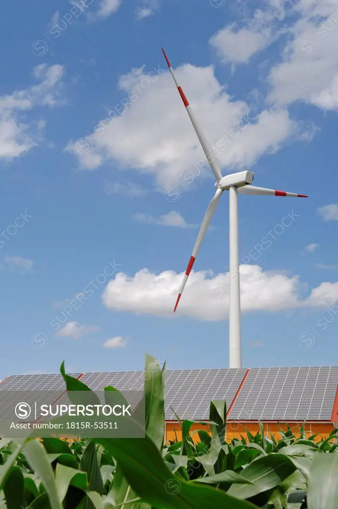 Germany, Baden_Wí¼rttemberg, Merklingen, Solar panels and wind turbine on roof